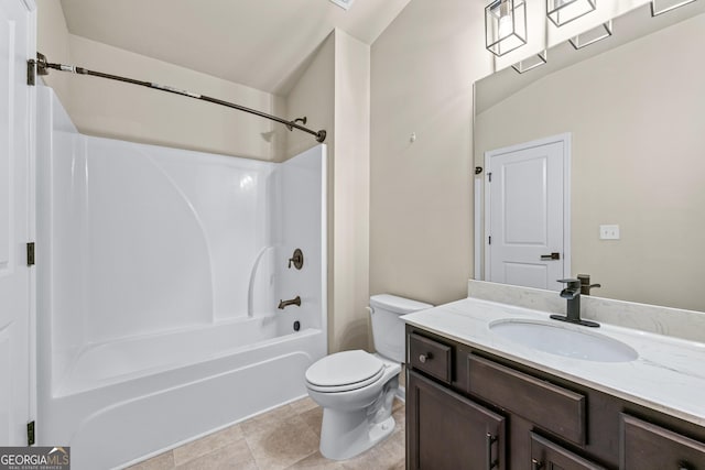 bathroom featuring tile patterned flooring, tub / shower combination, vanity, and toilet