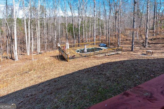 view of yard with a forest view