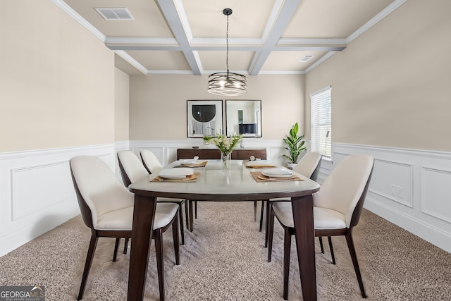 carpeted dining space with visible vents, coffered ceiling, beamed ceiling, and wainscoting