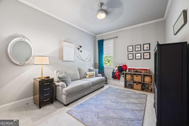 living area featuring light carpet, baseboards, a ceiling fan, and crown molding