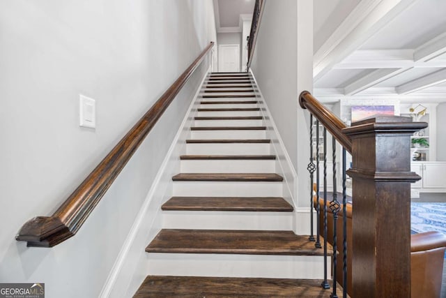 stairs with crown molding, coffered ceiling, and beamed ceiling