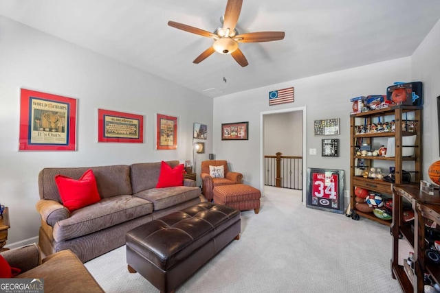 living room featuring light carpet and ceiling fan