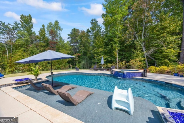 view of swimming pool with a pool with connected hot tub and a patio