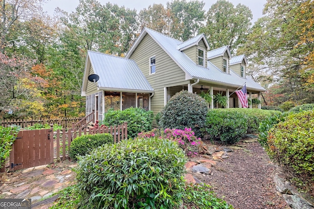 cape cod home with metal roof