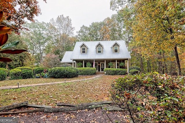 view of front of house featuring covered porch and metal roof