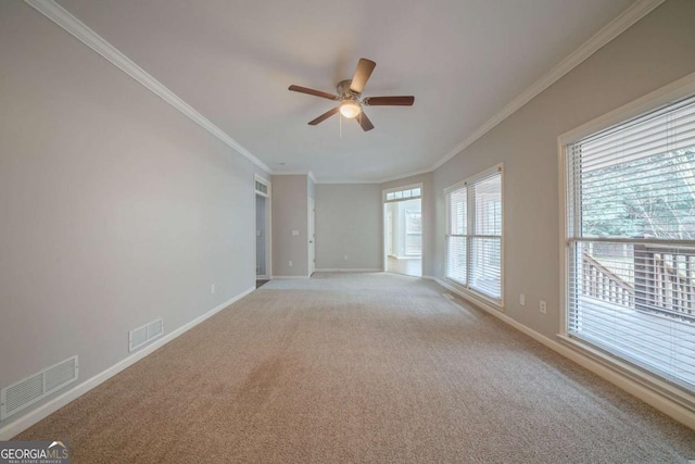 4570 Thicket Trl, Snellville, GA 30039 - empty room featuring ceiling fan, light colored carpet, and ornamental molding