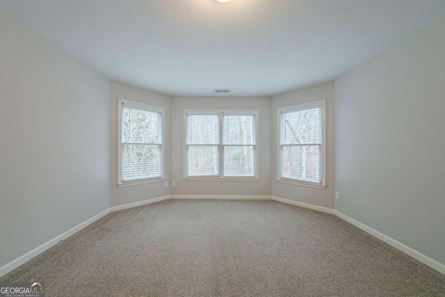 4570 Thicket Trl, Snellville, GA 30039 - spare room with carpet floors and baseboards