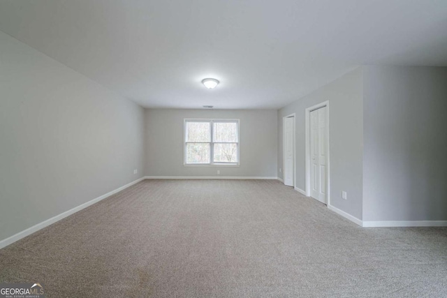 4570 Thicket Trl, Snellville, GA 30039 - spare room featuring carpet and baseboards