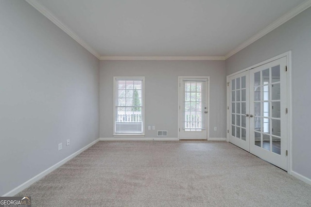 4570 Thicket Trl, Snellville, GA 30039 - empty room with french doors, ornamental molding, and carpet flooring