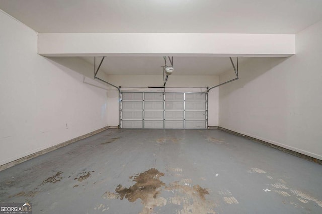 4570 Thicket Trl, Snellville, GA 30039 - garage featuring baseboards and a garage door opener