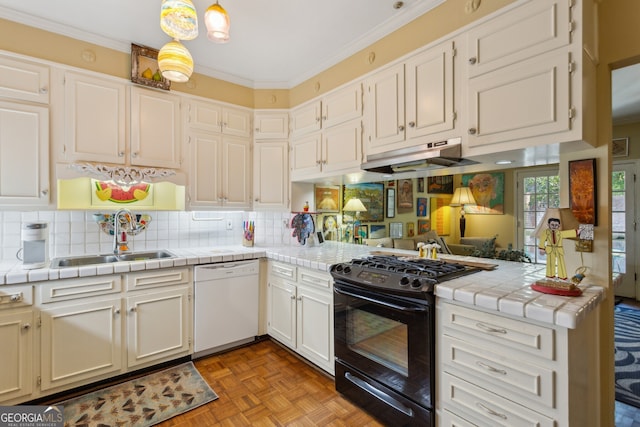 kitchen featuring tile counters, white dishwasher, under cabinet range hood, a sink, and gas stove