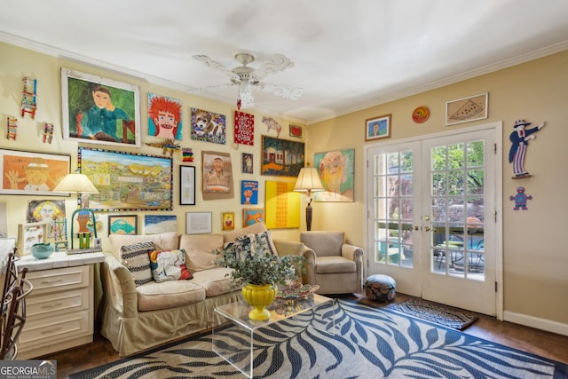 sitting room featuring french doors, crown molding, baseboards, and ceiling fan