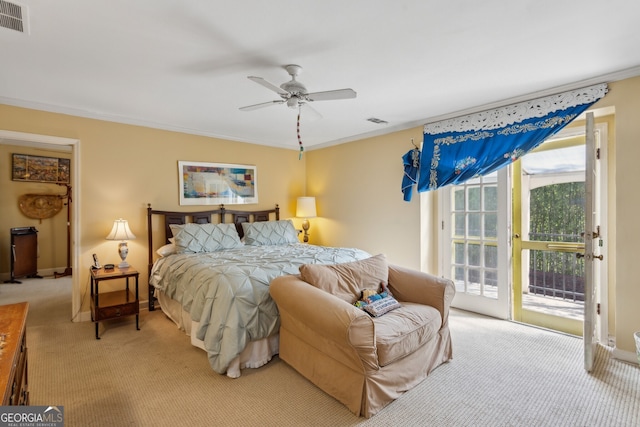 bedroom featuring access to outside, ornamental molding, visible vents, and light colored carpet