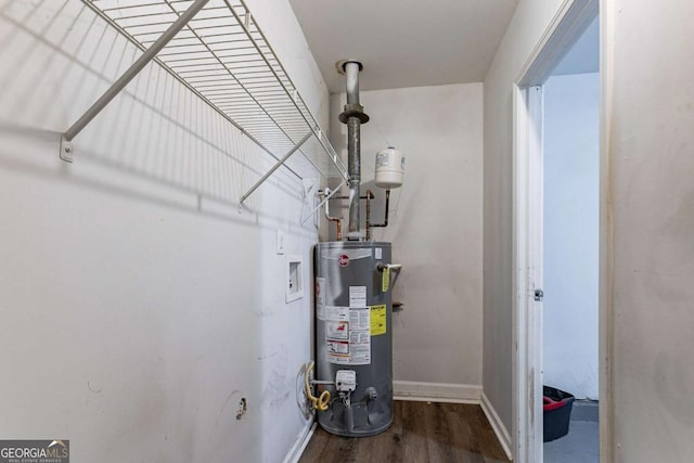 utility room featuring water heater