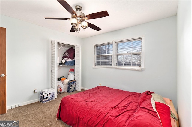 carpeted bedroom with a closet, ceiling fan, and baseboards