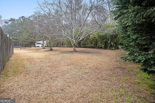 view of yard featuring fence