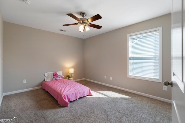 bedroom with carpet floors, visible vents, and baseboards