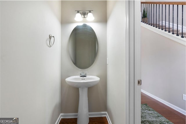 bathroom featuring baseboards and wood finished floors