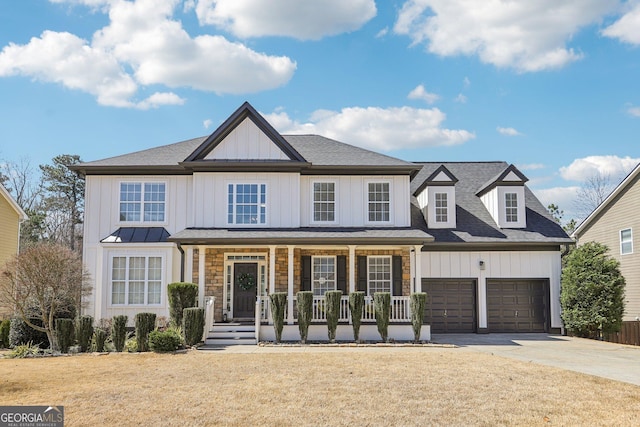 view of front of home with a porch, a shingled roof, concrete driveway, a garage, and board and batten siding