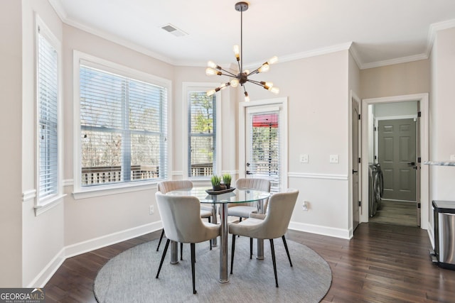 dining room featuring visible vents, crown molding, dark wood-type flooring, and an inviting chandelier