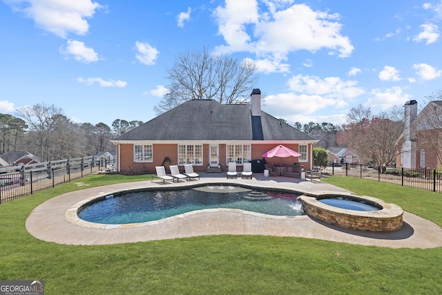 view of swimming pool with a patio area, a fenced backyard, french doors, and a yard