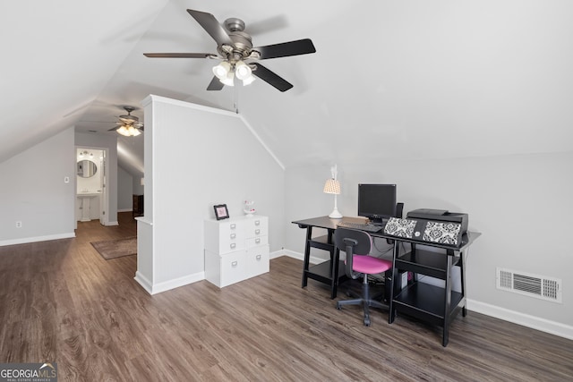 office with lofted ceiling, visible vents, and wood finished floors