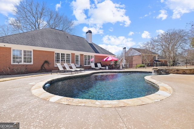 view of pool featuring a fenced in pool, a patio area, and fence