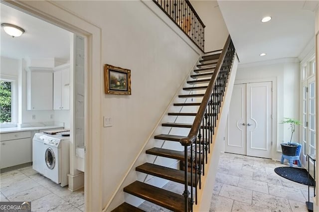 stairs with washer / clothes dryer, recessed lighting, stone tile flooring, and baseboards