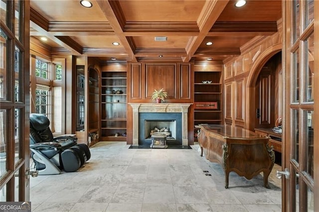 living area featuring built in features, coffered ceiling, wooden ceiling, beamed ceiling, and wood walls