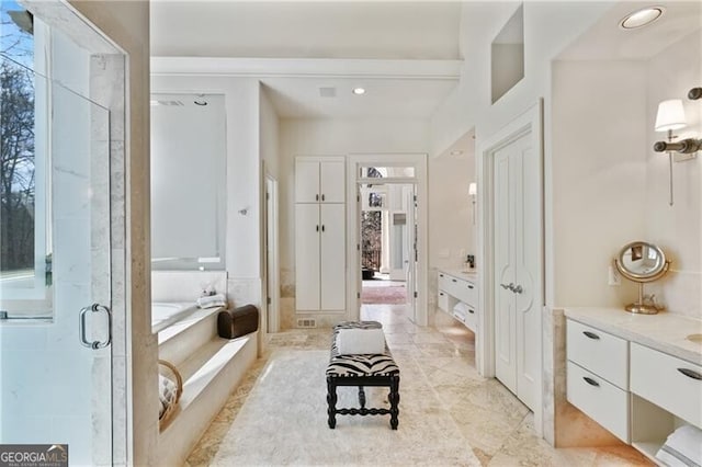 bathroom featuring a garden tub, visible vents, a shower stall, and vanity