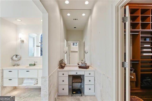 full bath with recessed lighting, a spacious closet, visible vents, and vanity