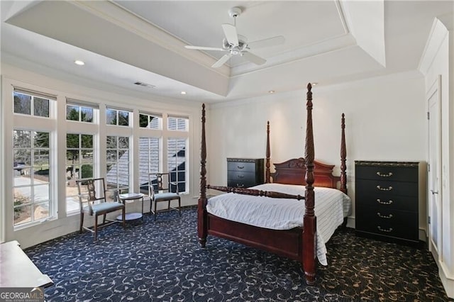 carpeted bedroom with a ceiling fan, recessed lighting, a raised ceiling, and crown molding