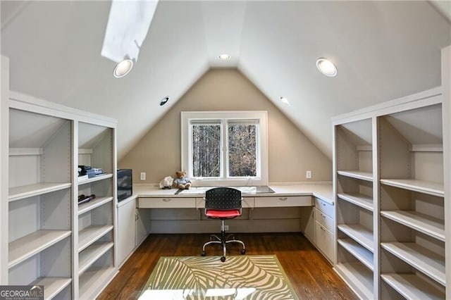 office area featuring dark wood-style floors, vaulted ceiling with skylight, built in study area, and recessed lighting