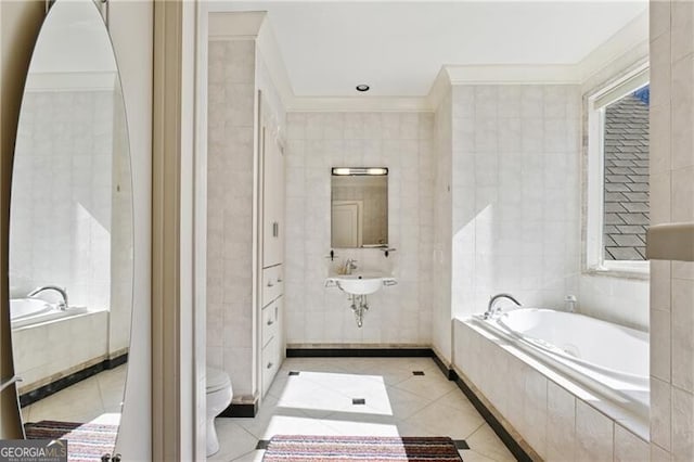 bathroom featuring crown molding, toilet, tile walls, and tile patterned floors