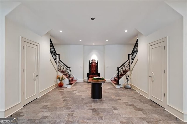 exercise area with baseboards and recessed lighting