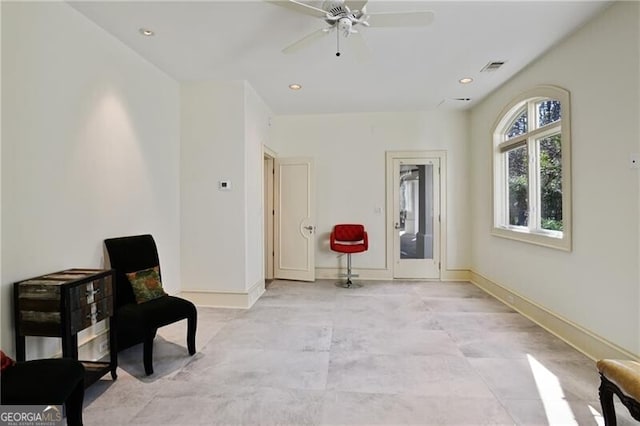 living area featuring recessed lighting, visible vents, ceiling fan, and baseboards