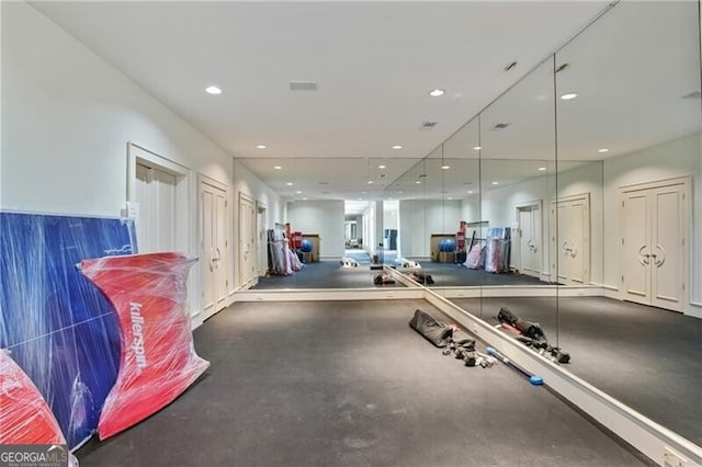 workout room featuring visible vents and recessed lighting