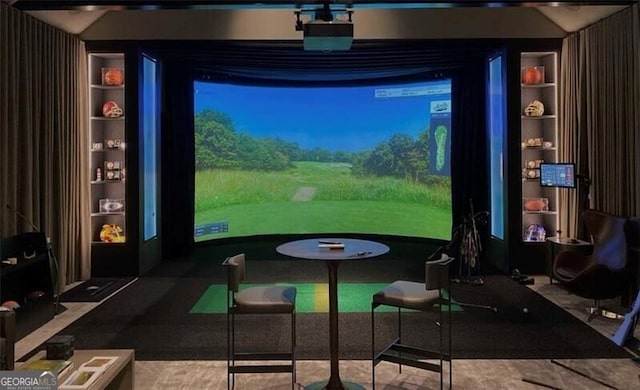 game room with golf simulator and built in shelves