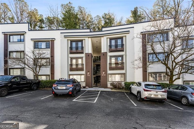 view of property featuring uncovered parking