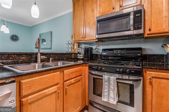 kitchen featuring brown cabinets, stainless steel appliances, hanging light fixtures, ornamental molding, and a sink