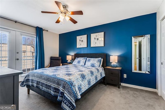 bedroom with light carpet, baseboards, a ceiling fan, access to exterior, and french doors