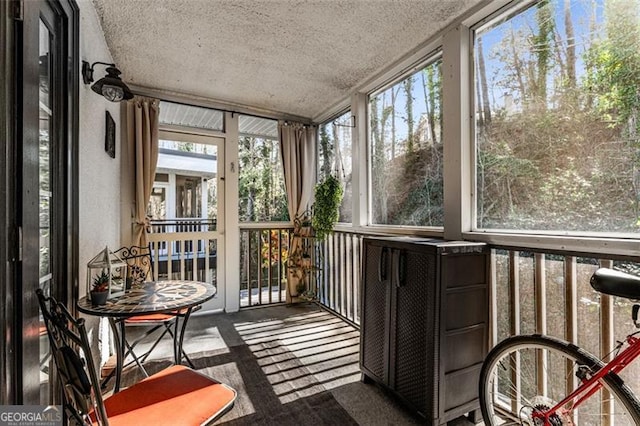 sunroom / solarium featuring a healthy amount of sunlight