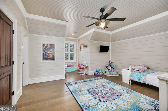 recreation room featuring baseboards, a ceiling fan, wooden ceiling, wood finished floors, and crown molding