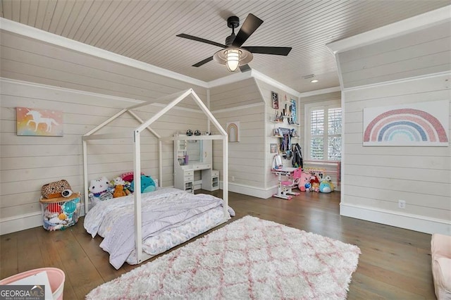 bedroom featuring a ceiling fan, wooden ceiling, baseboards, and wood finished floors