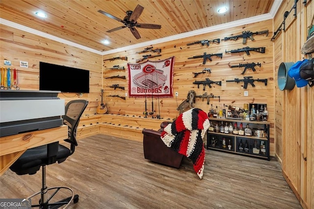 office space featuring ceiling fan, wood ceiling, wood walls, and wood finished floors