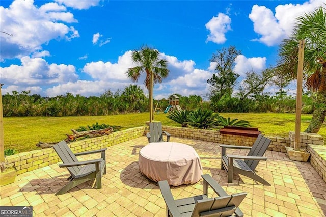 view of patio featuring a playground