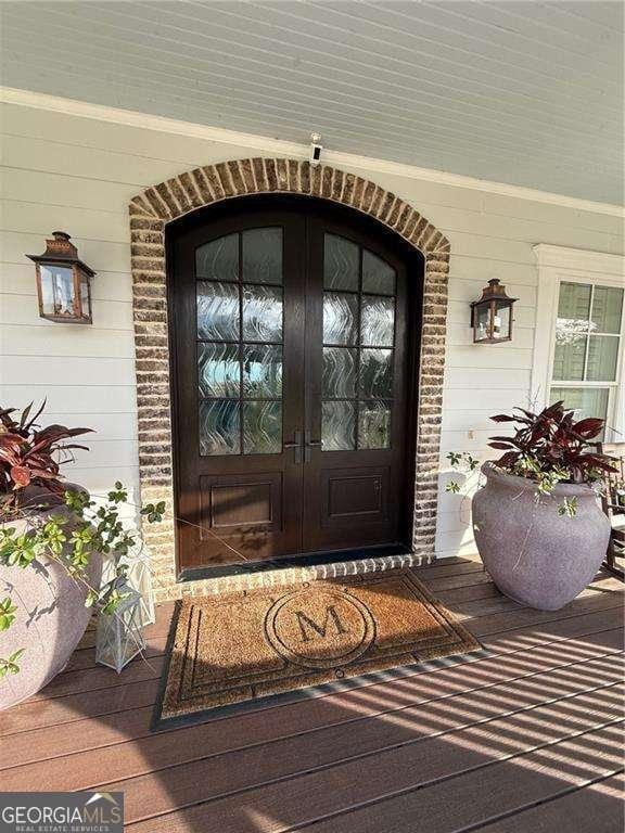 doorway to property featuring french doors