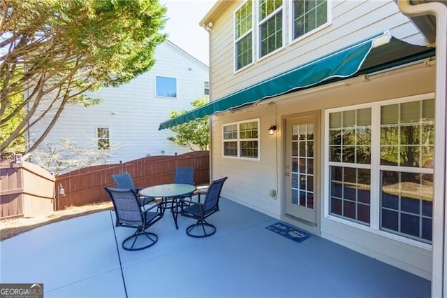 view of patio / terrace with outdoor dining space and fence