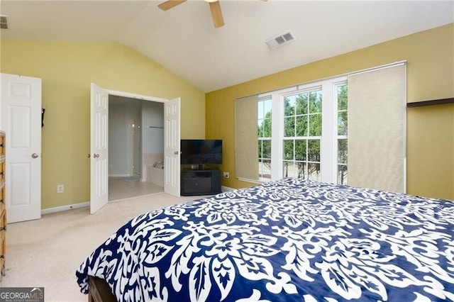 bedroom with light carpet, baseboards, visible vents, and vaulted ceiling