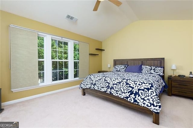 bedroom with carpet, visible vents, a ceiling fan, vaulted ceiling, and baseboards